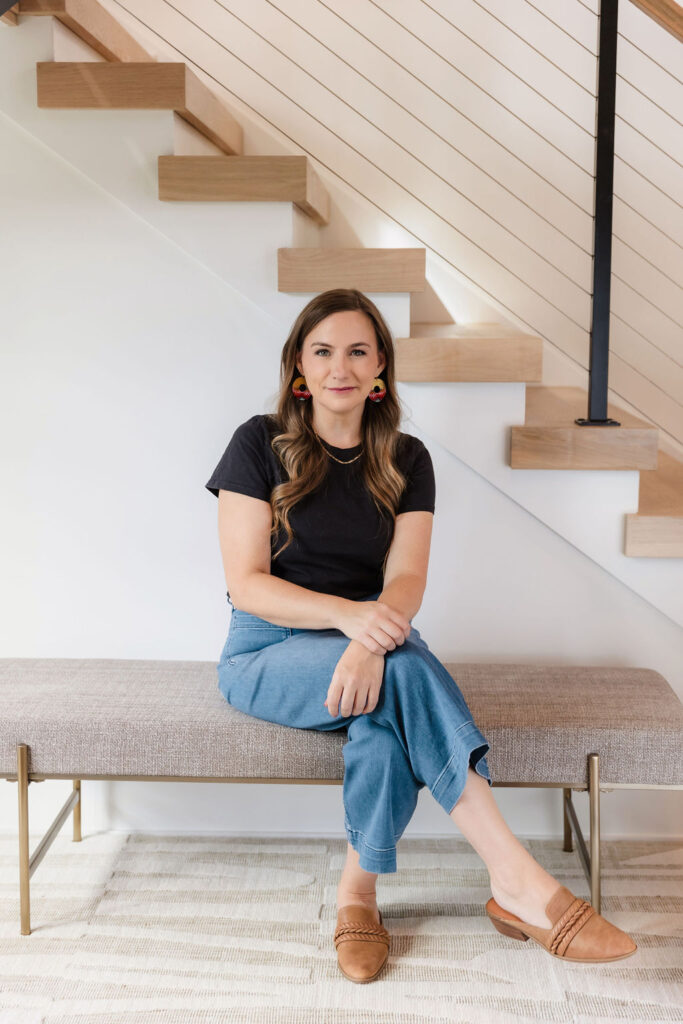Woman in black shirt sitting on bench