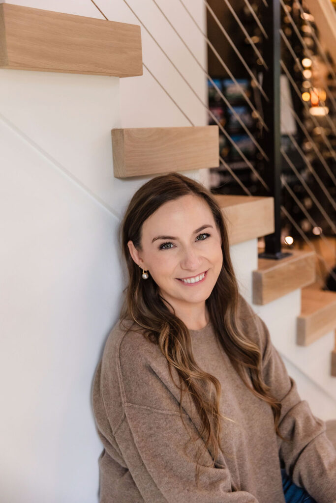 Woman leaning against staircase
