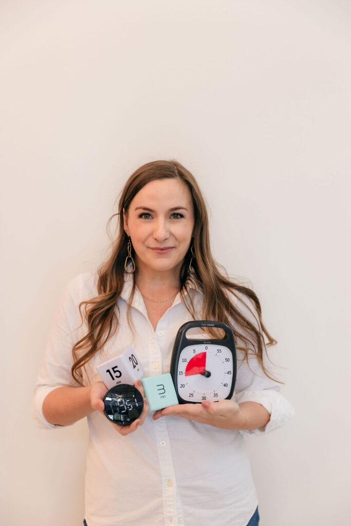 Woman holding multiple timers
